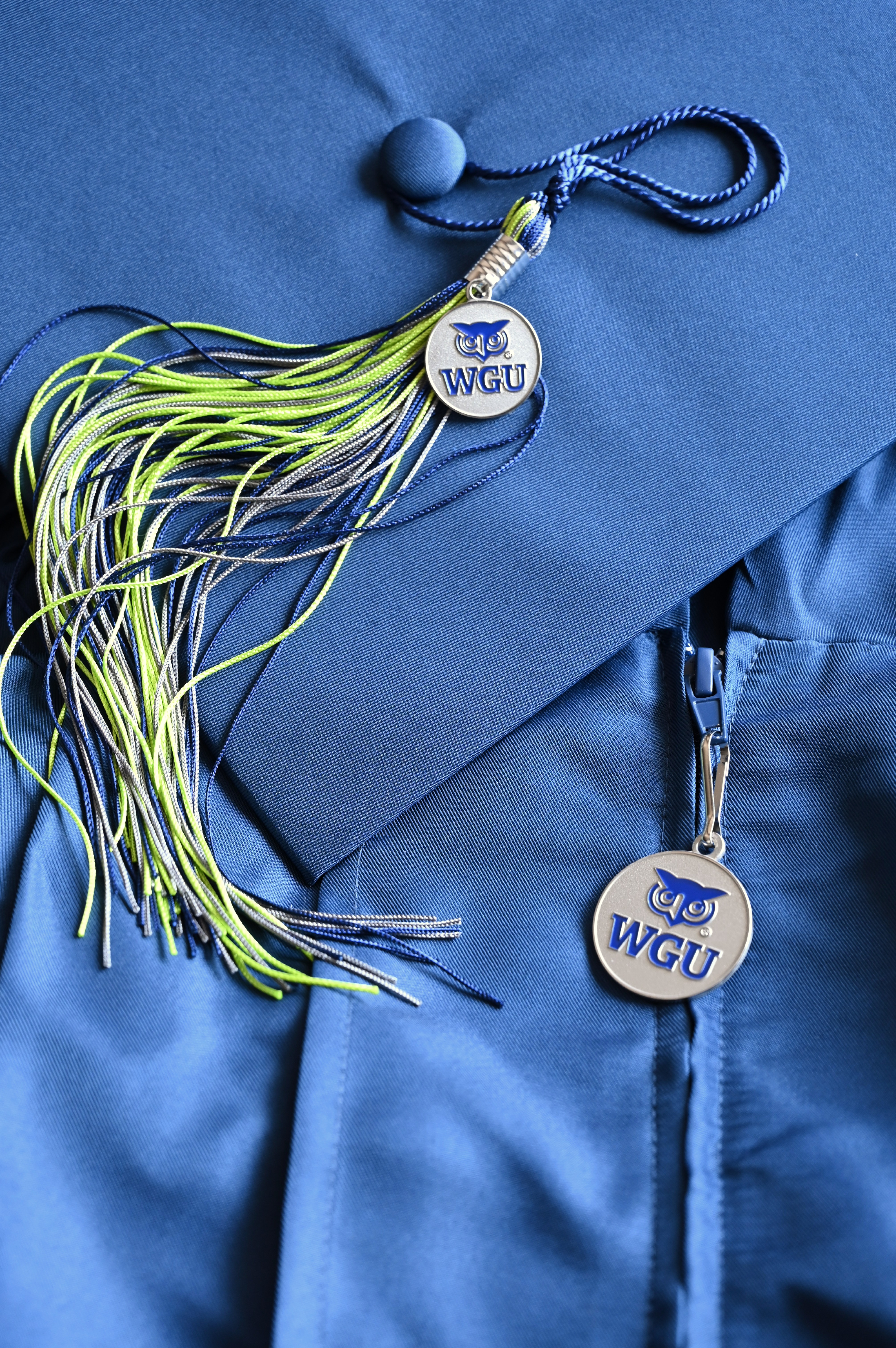 photo of gown, cap and tassel with charm